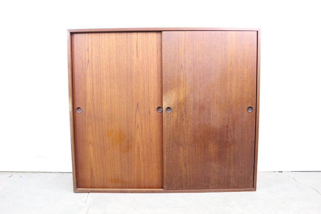 Mid-century Modern Teak Sliding Door Cabinet,Wall Mount: Mid-century Modern Teak Sliding Door Cabinet,Wall Mount. This beautiful cabinet is simple yet stylish with doors that slide open to reveal convenient shelves. It will look great in any room in the hou