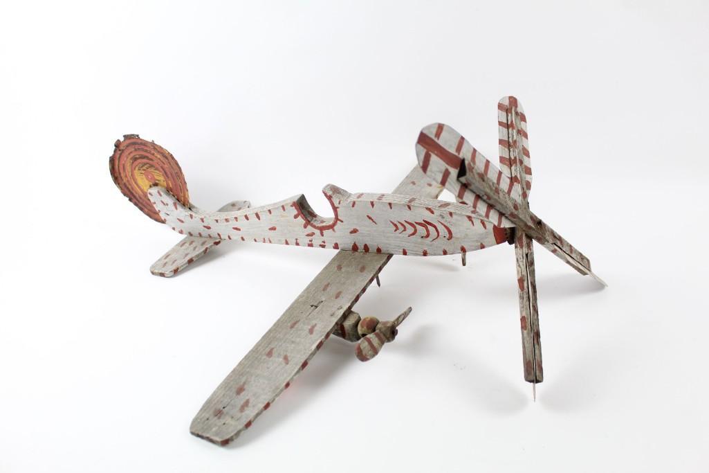 Folk Art Airplane Weathervane,Tin & Wood,Funky Painted: Folk Art Airplane Weathervane,Tin & Wood,Funky Painted. This delightful piece has wood proppelers that spin. The front propeller is made of wood and tin. The tail of the plane is also made of tin from