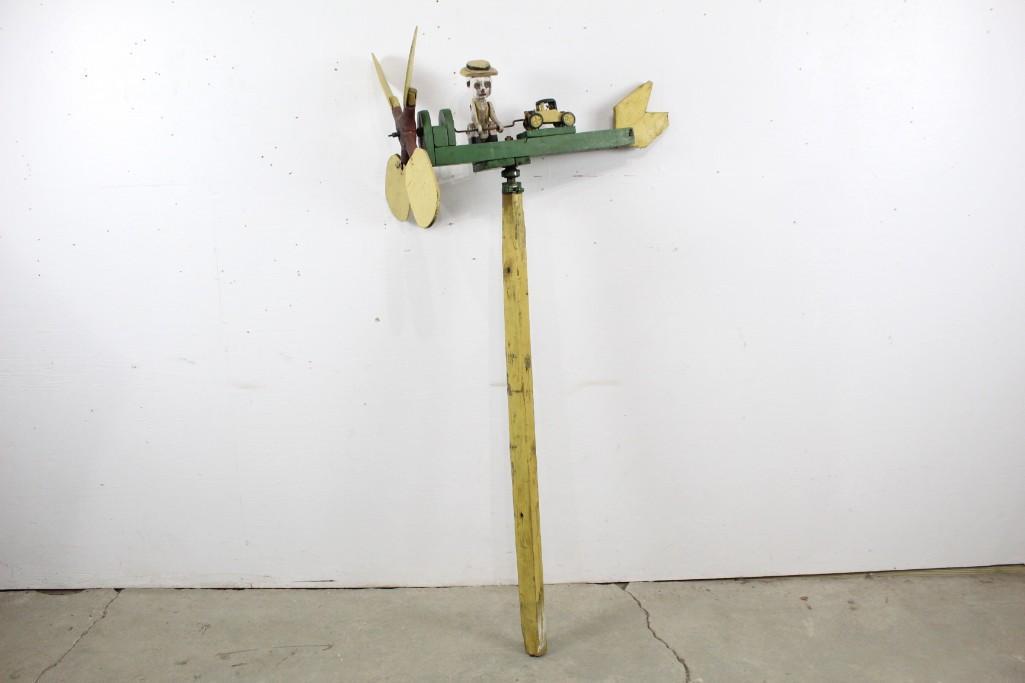 Painted Carved Wooden Folk Art Whirligig with Car/Plane: Painted Carved Wooden Folk Art Whirligig with Car, Plane & Figure. Brightly painted, this charming whirligig would make a great addition to your collection. The dimensions are 60.5 in h x 23.5 in w x 