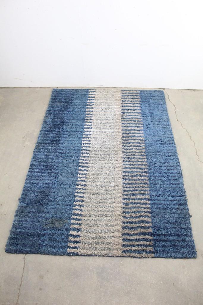 Mid-century Blue & White Striped Hand-knotted Rug: Mid-century Blue & White Striped Hand-knotted Rug. This rug would serve as a great addition to any room. The dimensions are 93 in h x 62 in w. Condition is fair, with minor edge wear & a small stain o