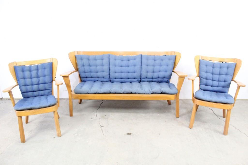 Fritz Hansen Midcentury Couch Chairs Set Blue Cushions: Set of couch and two chairs marked by famed Danish designer Fritz Hansen from the Mid-century modern era, with blue cushions. This set's subtly curved wood framing looks amazing from any angle - espec