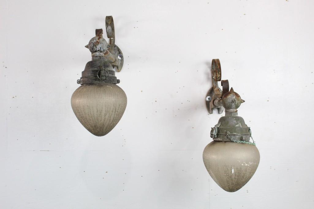 Pair Antique Industrial General Electric Street Lights: Pair of Antique Industrial General Electric GE Street Lights. Glass gumdrop shaped globes hang from metal mounts which have a nice green patina. Perfect for outdoor lighting in your garden or building
