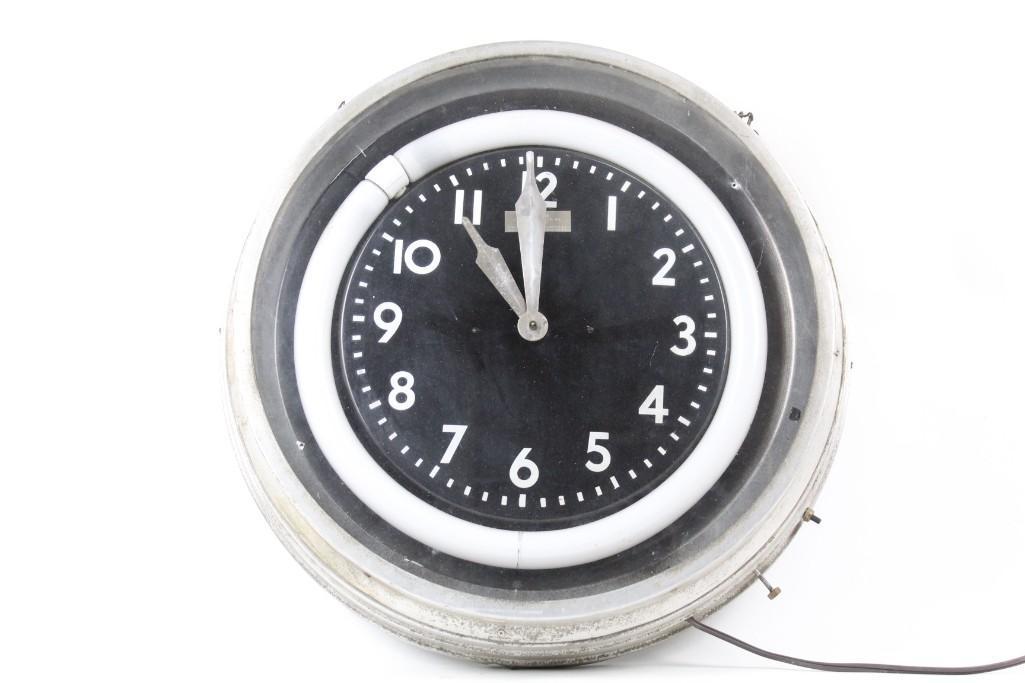 Aluminum Deco Clock by Modern Clock Advertising Co: Aluminum Deco Clock by Modern Clock Advertising Co. ATTENTION: This clock is a neon style clock but is Not neon, it is a fluorescent light bulb. This marvelous clock is big and bold. Never will you be