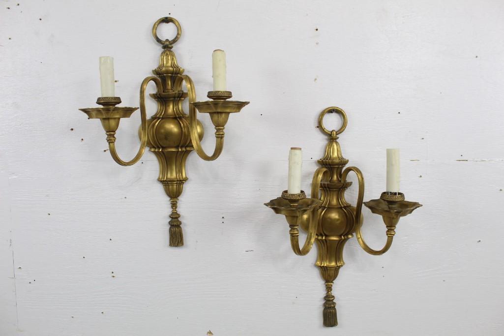 Pair of Caldwell Gold Painted Bronze Wall Sconces: Pair of Caldwell Gold Painted Bronze Wall Sconces featuring tasseling designs at the bottom. These sconces would be a tremendous addition to any dining space. The dimensions are 18.5 in h x 11.5 in w 