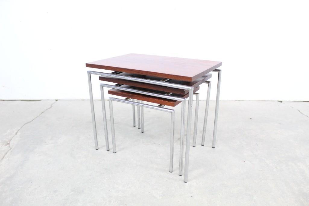 Set of Three Rosewood Nesting Tables,Mid-Century Modern: Set of Three Rosewood Nesting Tables,Mid-Century Modern. Frame is metal, table top is wood. Each smaller table can slide easily under the larger for simple storage. Set these up in front of the TV, pr
