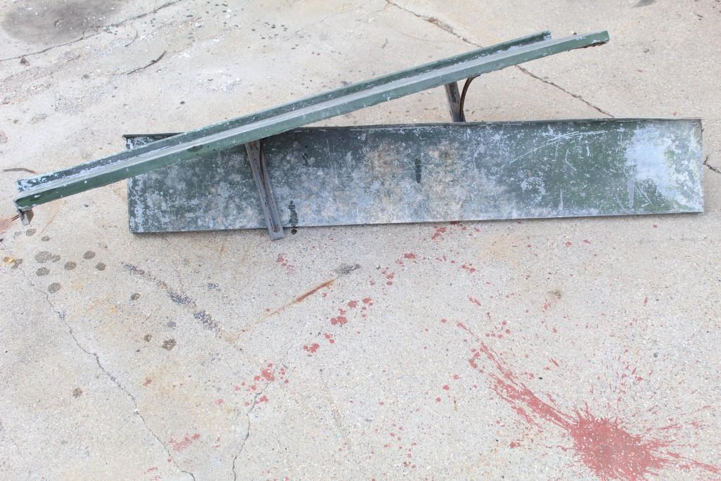 Set of Two Painted Green Metal Surfaced Wood Shelves: Set of two green painted metal surfaced wooden shelves, with two metal mounting brackets on each. Paint on metal shows amazing patina and character. Companion to two shorter shelves also in this aucti
