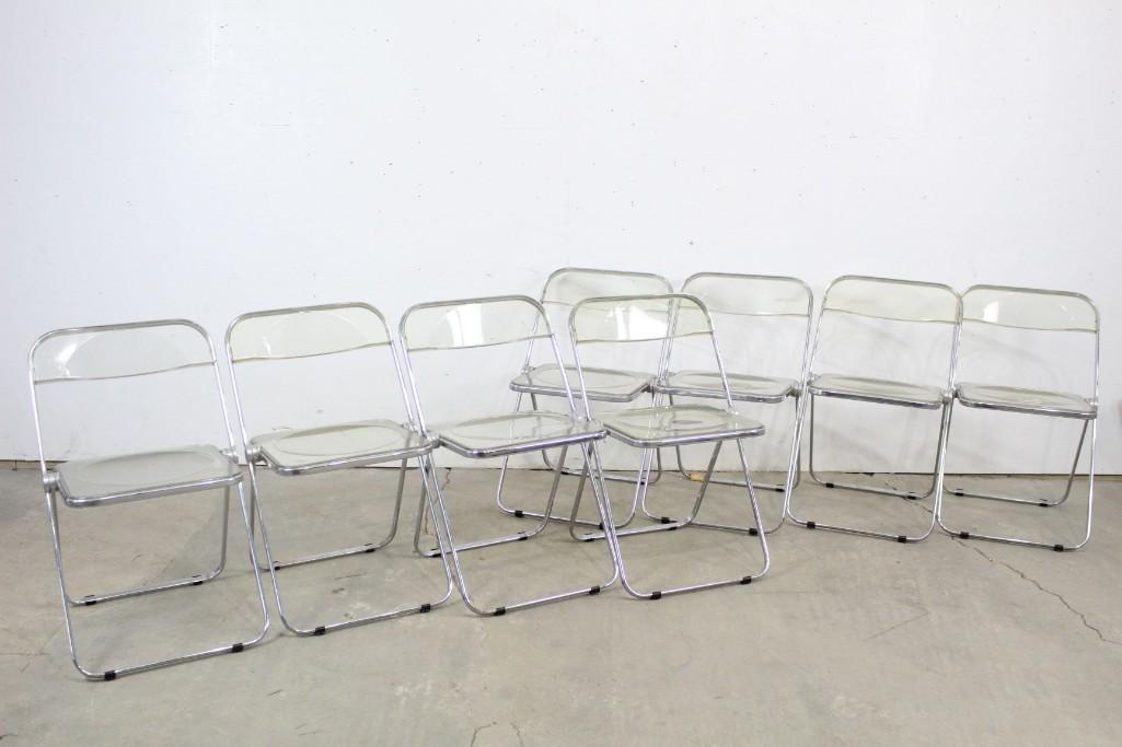 Mid-century Stylish Lucite Chrome Folding Chairs, Set 8: Set of eight mid-century modern chairs made of transparent lucite and chrome, with gentle rounded forms on seat bottom and back for added comfort. Back of seats marked "Plia patent Anonima Castelli It