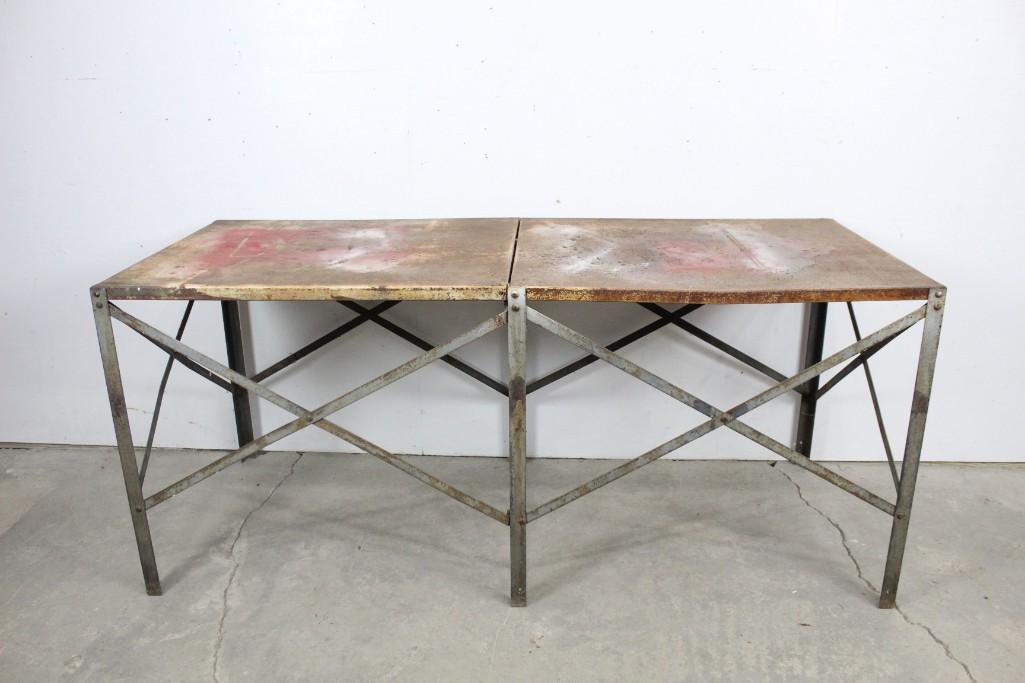 Industrial Rusty Metal Work Table from Factory: Industrial rustic metal table with cross details. This table has a great industrial design. It has nice details like the crossed metal supports. The dimensions are 31.5in h x 72in w x 30.25in d. It is