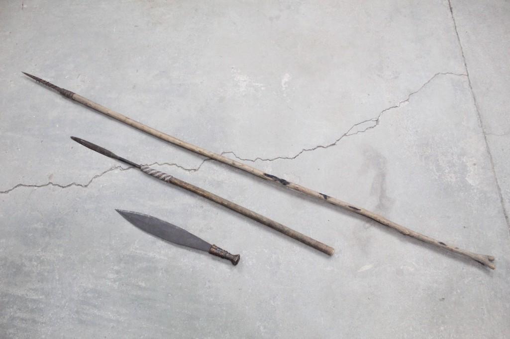 Lot of 3 Primitive Weapons, 2 Spears, 1 Machete: Lot of 3 Primitive Weapons, 2 Spears, 1 Machete. All have wooden handles. Machete has "MM" engraving down center of blade/close to handle. These would be great as wall hangings. The dimensions range f