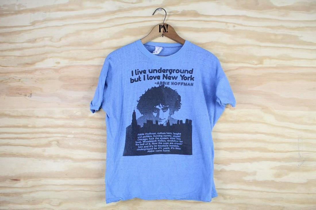 Blue M Abbie Hoffman I Live Underground Vintage T-shirt: SHIPPING: We will ship this item in-house, for a $12 flat rate to the Continental US; $2 for each additional shirt. Please contact us for a shipping quote on larger quantities. Blue M Abbie Hoffman I
