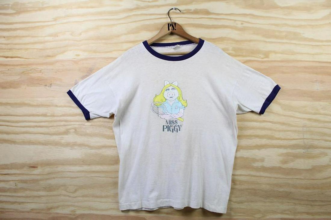 White Ringer Miss Piggy Muppets Vintage T-Shirt 1979: SHIPPING: We will ship this item in-house, for a $12 flat rate to the Continental US; $2 for each additional shirt. Please contact us for a shipping quote on larger quantities. White Ringer Miss Piggy