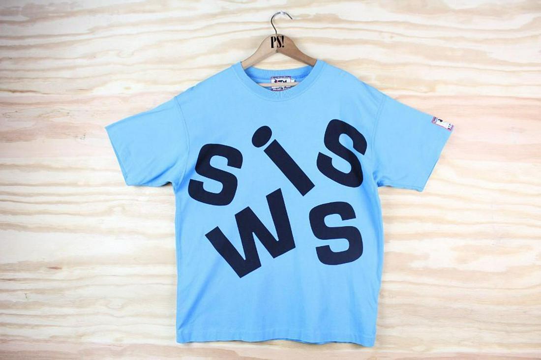 Blue M/L Swiss Ethno Fever Michel Jordi Vintage T-Shirt: SHIPPING: We will ship this item in-house, for a $12 flat rate to the Continental US; $2 for each additional shirt. Please contact us for a shipping quote on larger quantities. Blue M/L Swiss Ethno Fe