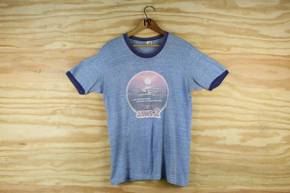 Blue S/M Jaws 2 Movie Promo Vintage Ringer T-Shirt 1976: SHIPPING: We will ship this item in-house, for a $12 flat rate to the Continental US; $2 for each additional shirt. Please contact us for a shipping quote on larger quantities. Blue S/M Jaws 2 Movie P
