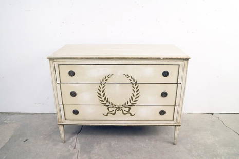 Antique Painted & Stenciled Wood Chest Drawers Dresser: Antique Painted & Stenciled Wood Chest Drawers Dresser. Dresser is painted cream, and has a stenciled wreath with ribbon on the center of the front. Each drawer has 2 metal pulls. 4 tapered legs.