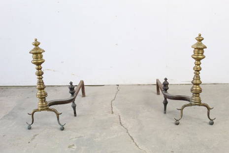 Pair of Antique 19thC Tall Brass & Iron Andirons: Pair of ornate brass and iron andirons. This would be a great, classic addition to any fireplace. Dimensions are 21 in h x 9 in w x 24 in d. Condition is fair, with minor surface wear, and a