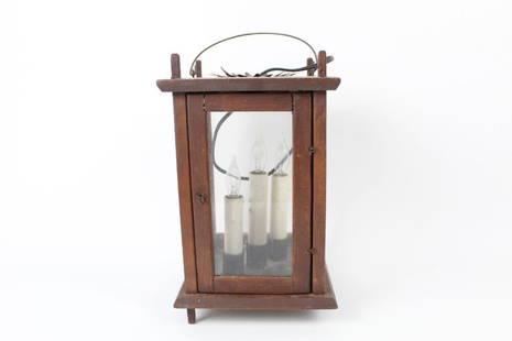 Hanging Wood & Glass, Electric Candle Lantern Light: Enclosed wooden box light with glass paneling and wire petaling coming out of the top. This light would bring a warm glow to a cabin setting. Dimensions are 15.25 in h x 7.25 in w x 7.25 in d.