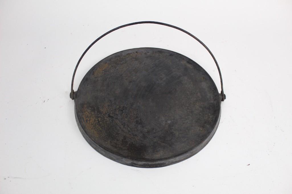 Griswold's Erie extra finished ware 741 No12 cast iron: Griswold's Erie extra finished ware 741 No12 cast iron pan with handle. Dimensions are 12 in h x 7 in w x 7 in d.