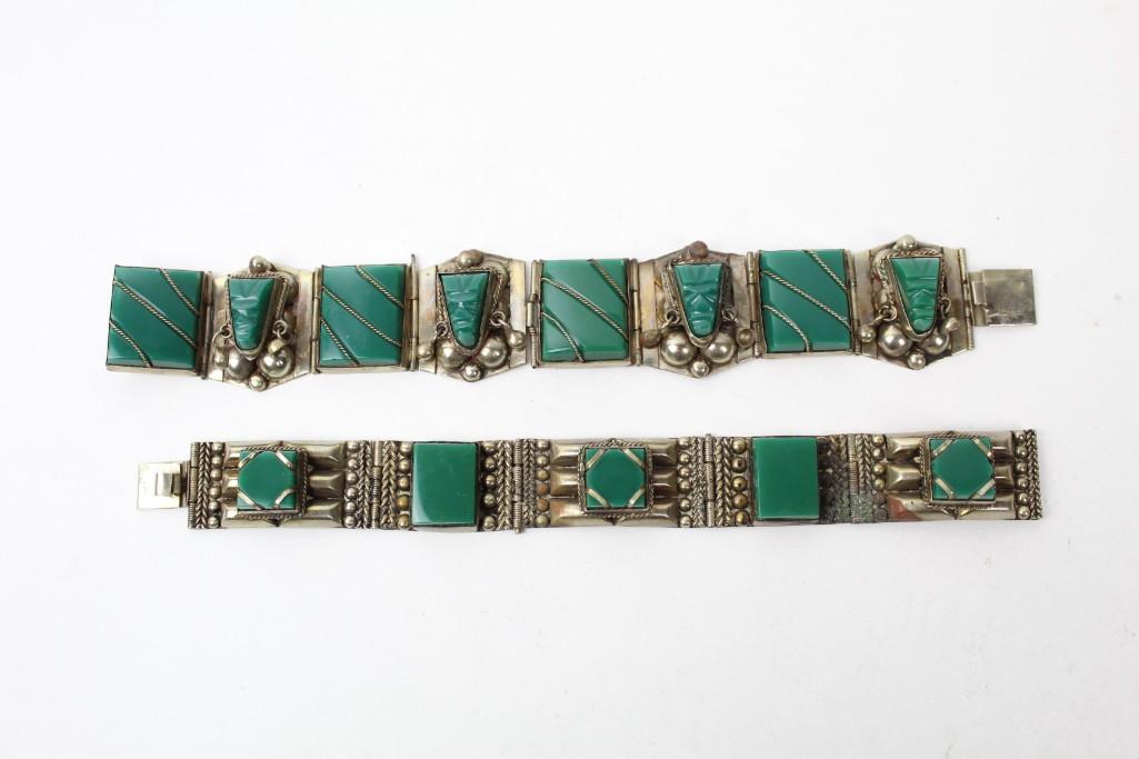 Pair of Antique Sterling Silver Bracelets,Taxco Mexico: Pair of attractive Sterling Silver bracelets with green stones set throughout. Both have ornate silverwork, and one has green stone carved faces. Stamped on inside of clasp, "Sterling" and "Mexica". S