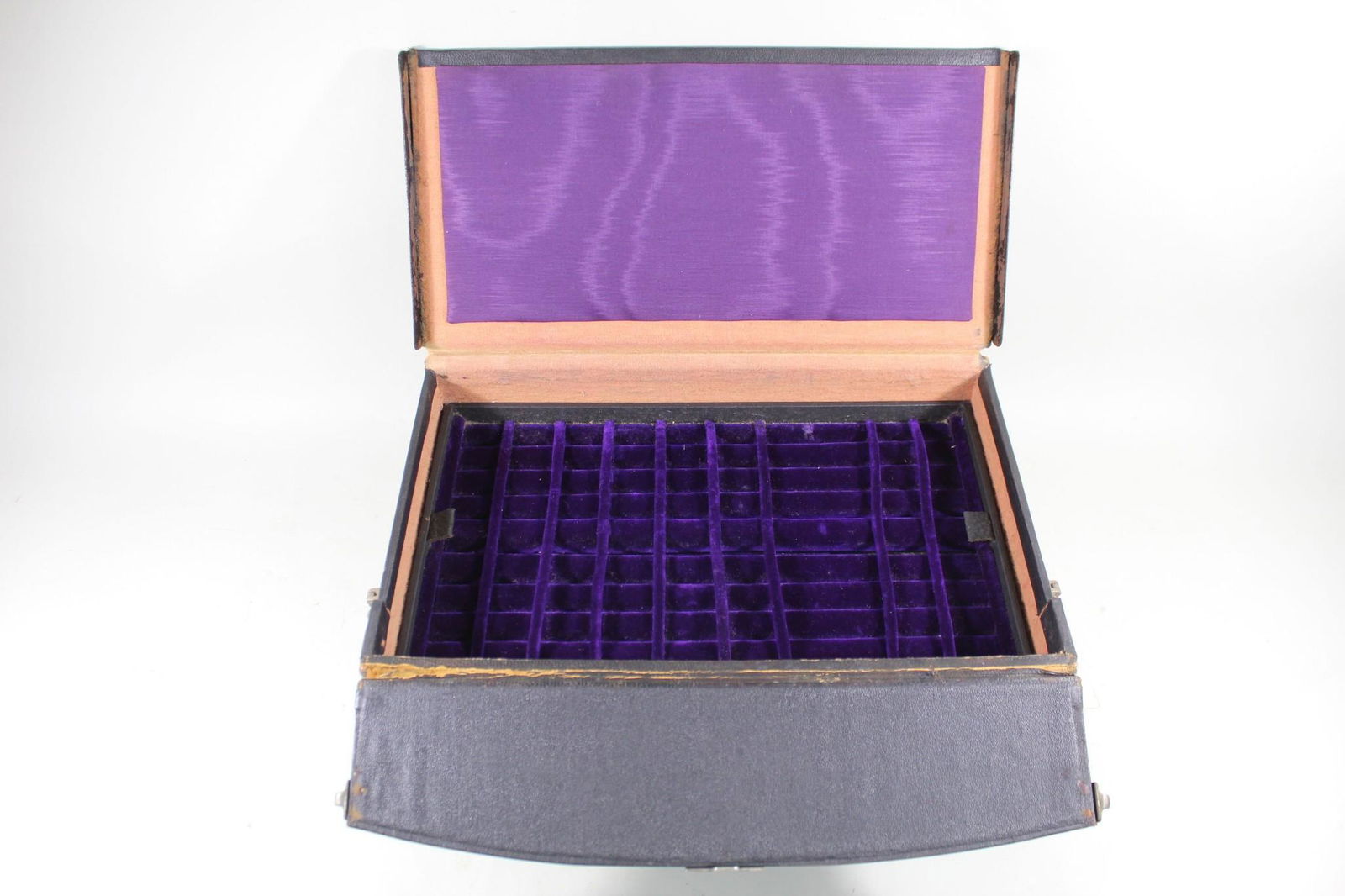 Traveling Salesman's Sample Velvet Lined Jewelry Case: Traveling Salesman's Black Leather Purple Velvet Jewelry Case. The interior has a luscious purple velvet lining three tiers of various sized compartment for different pieces of jewelry. Includes decor