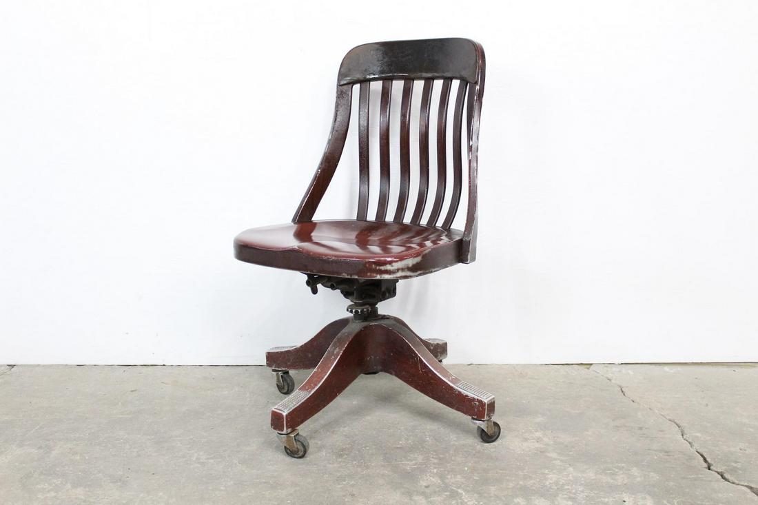 Aluminum Goodform Curved Swivel Bankers Office Chair: Aluminum Goodform Curved Swivel Bankers Office Chair. This chair is made out of aluminum, and is painted with a rich cherry red and brown faux wood grain. It is an early (unmarked) Goodform armchair i
