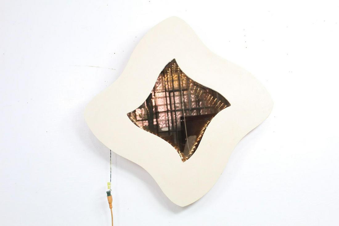 1980s David Marshall Lighted Infinity Wall Mirror: 1980s David Marshall Lighted Infinity Wall Mirror. This is a wall mounted infinity mirror from David Marshall. The frame is a funky, abstract shape, while the mirror has a series of small lights, maki