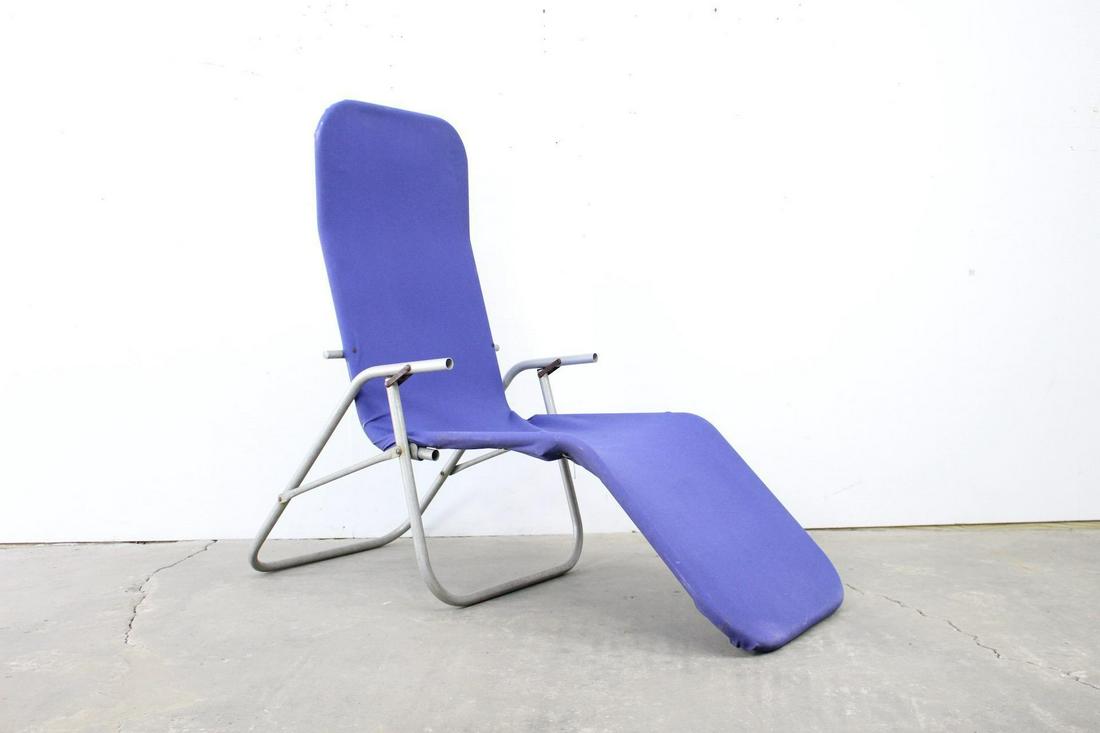 Modern Purple Aluminum & Canvas Reclining Lounger: Modern Purple Aluminum & Canvas Reclining Lounger. This is a modern lounge chair. The purple canvas is attached to the frame by rope that weaves through grommets on the back. The chair reclines for in