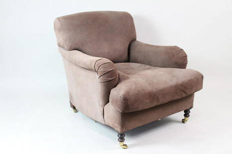 George Smith Suede Leather Club Chair w/Brass Casters: George Smith Suede Leather Club Chair w/Brass Casters. This is a handsome suede club chair. It has a deep seat and a low back. The small turned legs have brass casters. On the bottom of the chair is