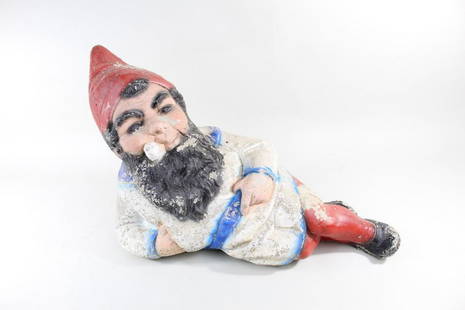 Painted Concrete Garden Gnome Statue, Lawn Ornament: Painted Concrete Garden Gnome Statue, Lawn Ornament. This is a lawn ornament of a garden gnome. It is painted concrete. He reclines on his side, smoking a pipe and holding his belt. This delightful