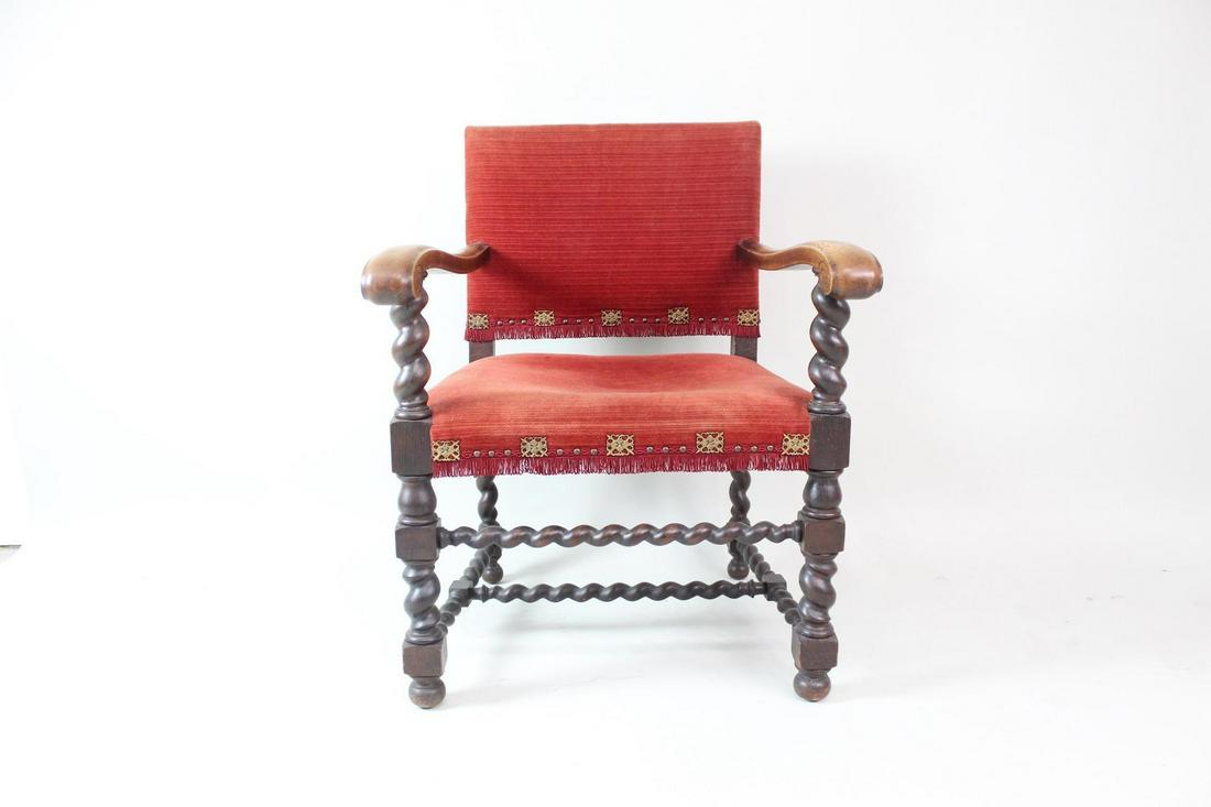 Red & Wood Renaissance Style Arm Chair W/Turned Legs: Red & Wood Renaissance Style Arm Chair W/Turned Legs. A stately arm chair with turned legs, stretchers and arms in dark brown wood with wear and patina to the arm rests. Upholstered in a deep red velv