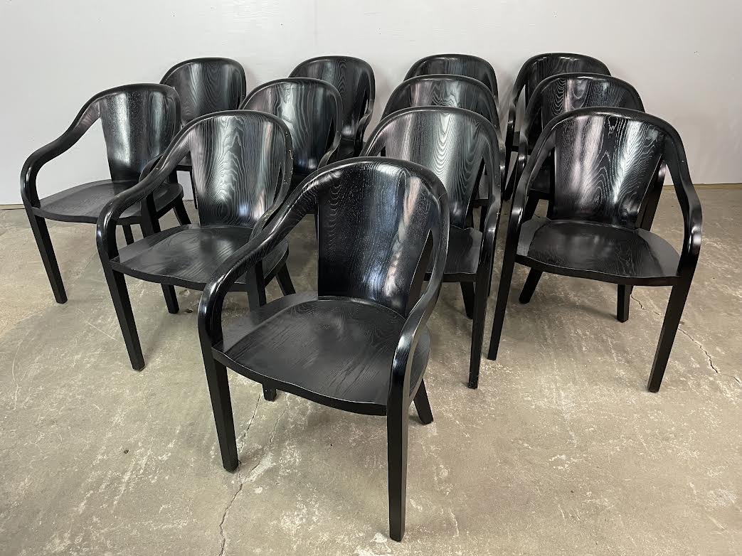 12 Ward Bennett Ebonized Oak University Library Chairs: Set of 12 Ward Bennett Ebonized Oak University Chairs. Matching chairs are made simply of oak that has been ebonized, have carved seats and rounded arms and backs, and are labeled Ward Bennett Designs