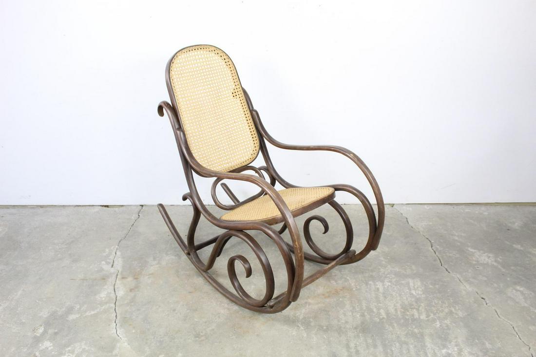 Thonet Style Bentwood Rocker Rocking Chair w/ Cane Seat: Thonet Style Bentwood Rocker Rocking Chair w/ Cane Seat. This is an elegant Bentwood rocking chair in the style of Michael Thonet (Austrian, 1796-1871). It has a classic Bentwood design, with beautifu
