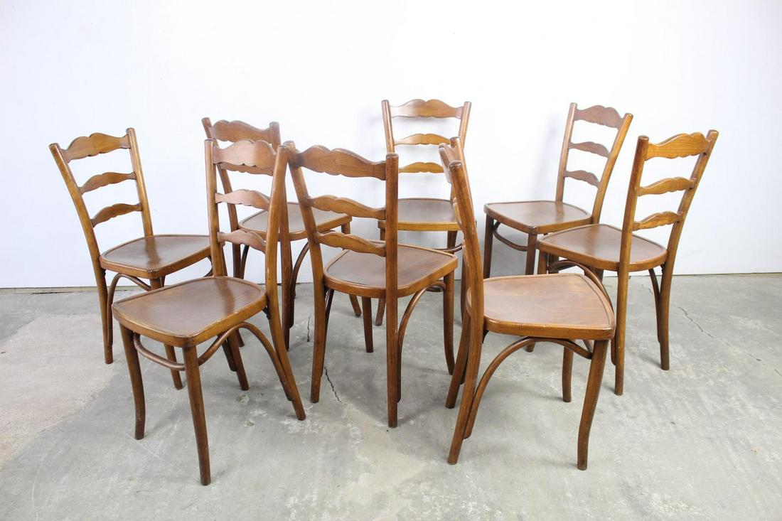 8 Reischmann Ladder Back Wooden Dining Chairs, Bentwood: Set of 8 Reischmann Ladder Back Wooden Dining Chairs. The backs of the chairs have nicely curved sides and beautifully carved slats. The legs also have nice bentwood details. A label on the underside