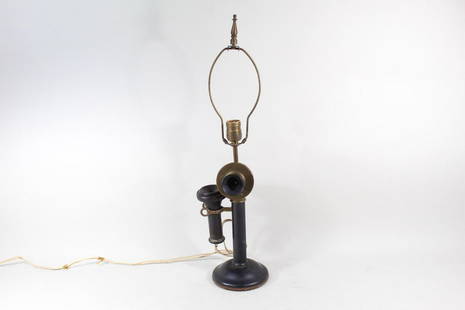 Western Electric Tel&Tel Co Candlestick Telephone Lamp: Western Electric American Tel&Tel Co Candlestick Phone. This antique item is both a lamp and candlestick phone. It is made of brass. This candlestick phone is marked "Western Electric, Made in USA"