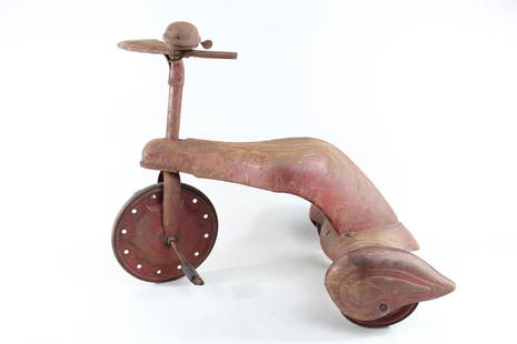 Red Streamline Pressed Steel Art Deco Tricycle w/Wing: Red Streamline Metal Tricycle w/ Wing Wheels & Bell. This is a red metal streamline tricycle in an Art Deco style. It has an interesting front wheel. The sleek seat slopes down into the back wheels,