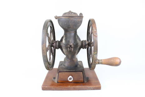 Cast Iron Landers Frary & Clark Coffee Grinder Mill: Antique Cast Iron Landers Frary & Clark Coffee Mill. Mill for grinding coffee beans by hand is made of cast iron and wood. Cast in one of the wheels is "Landers, Frary & Clark," New Britain Conn.
