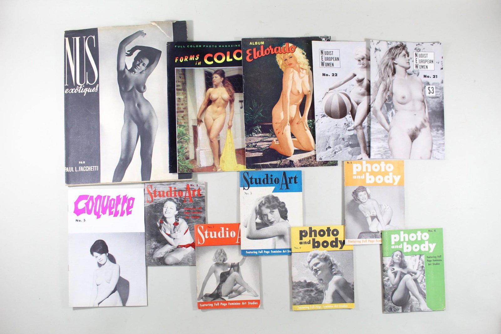 12 Artful Photography Magazines,Nude Models,Women,50's: 12 Artful Magazines w/ Nude Models, Women, 1950s, 1960s. This is a lot of 12 magazines featuring photographs of nude women from the 1950s and 1960s. There is one copy of "NUS Exotiques" from the 1950s