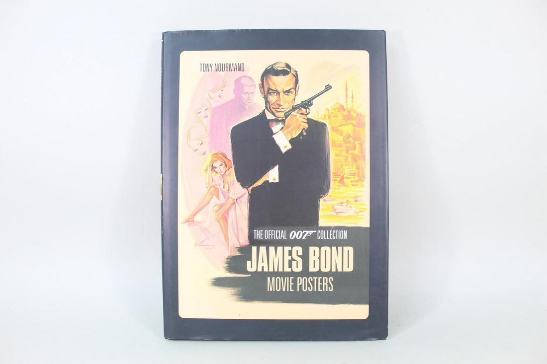 Signed Joseph Caroff James Bond Book of Movie Posters: Signed Joseph Caroff James Bond Book of Movie Posters. This copy of James Bond Movie Posters: The Official Collection by Tony Nourmand is signed by Joseph Caroff, the designer of the original "007" lo