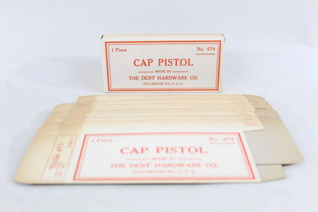 10 Original Boxes for Dent Cast Iron Cap Guns Pistol: Lot of 10 Vintage Cardboard Dent Hardware Cap Gun Boxes. Boxes are white with red lettering, and read, Cap Pistol/Made by The Dent Hardware Co./Fullerton, PA. U.S.A. This is a lot of empty boxes; cap