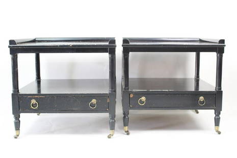 Black & Brass Hollywood Regency Side Tables: Black & Brass Hollywood Regency Side Tables. An elegant pair of low side tables on casters with neoclassical style/art deco style. In black painted wood with brass feet and pulls. The top is framed on