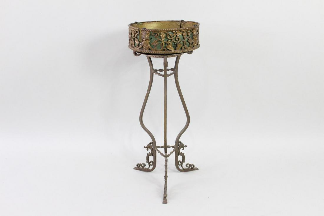 Electrified Cast Iron Plant Stand / Bird Bath Fountain: Electric Iron Plant Stand Bird Bath Fountain w/Light. An electric fountain in cast iron that can also function as a plant stand by removing the upper fountain part. Ornate legs and frame with grape wi