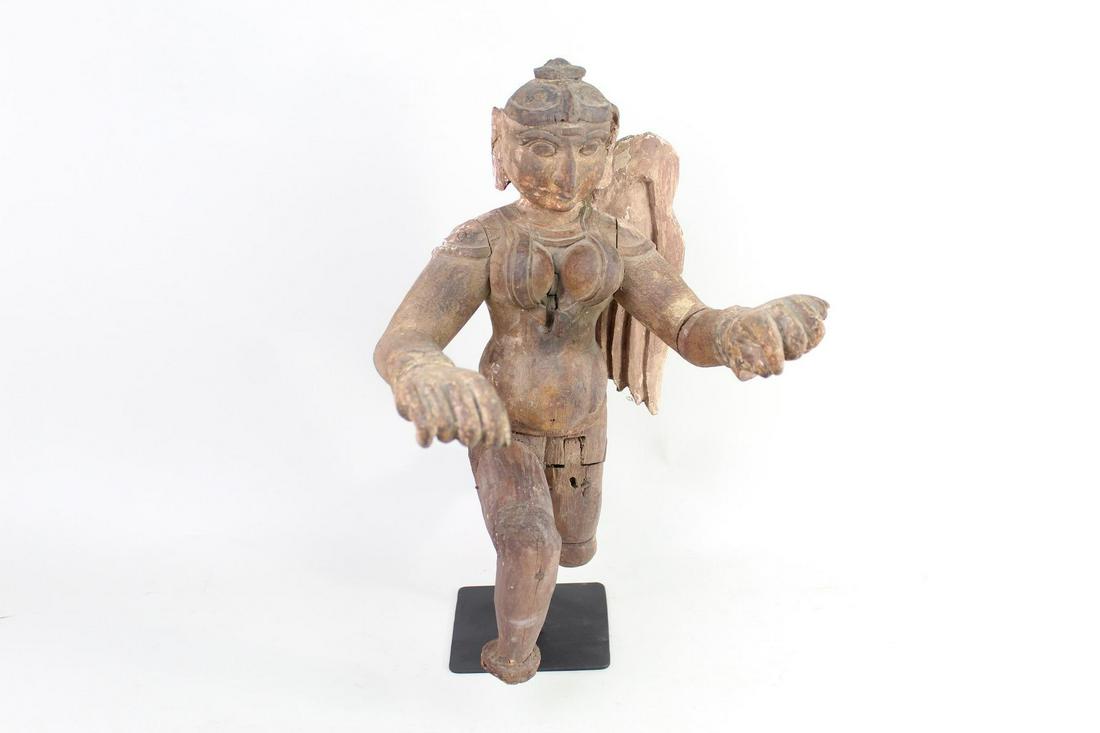 Colonial Indian Female Angel Hindu Deity Sculpture: Colonial Indian Female Angel Hindu Deity Sculpture. A carved wooden sculpture of a female winged deity from Colonial era India. Her arms are outstretched and one leg moving forward and one back. Great