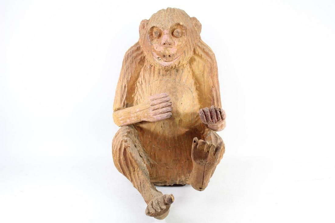 Roughly Carved Mexican Folk Art Chimpanzee Sculpture: Roughly Carved Mexican Folk Art Chimpanzee Sculpture. A seated chimpanzee, roughly carved, with out stretched hands. Carved out of one piece of wood, with exception of the lower arms and feet, which h