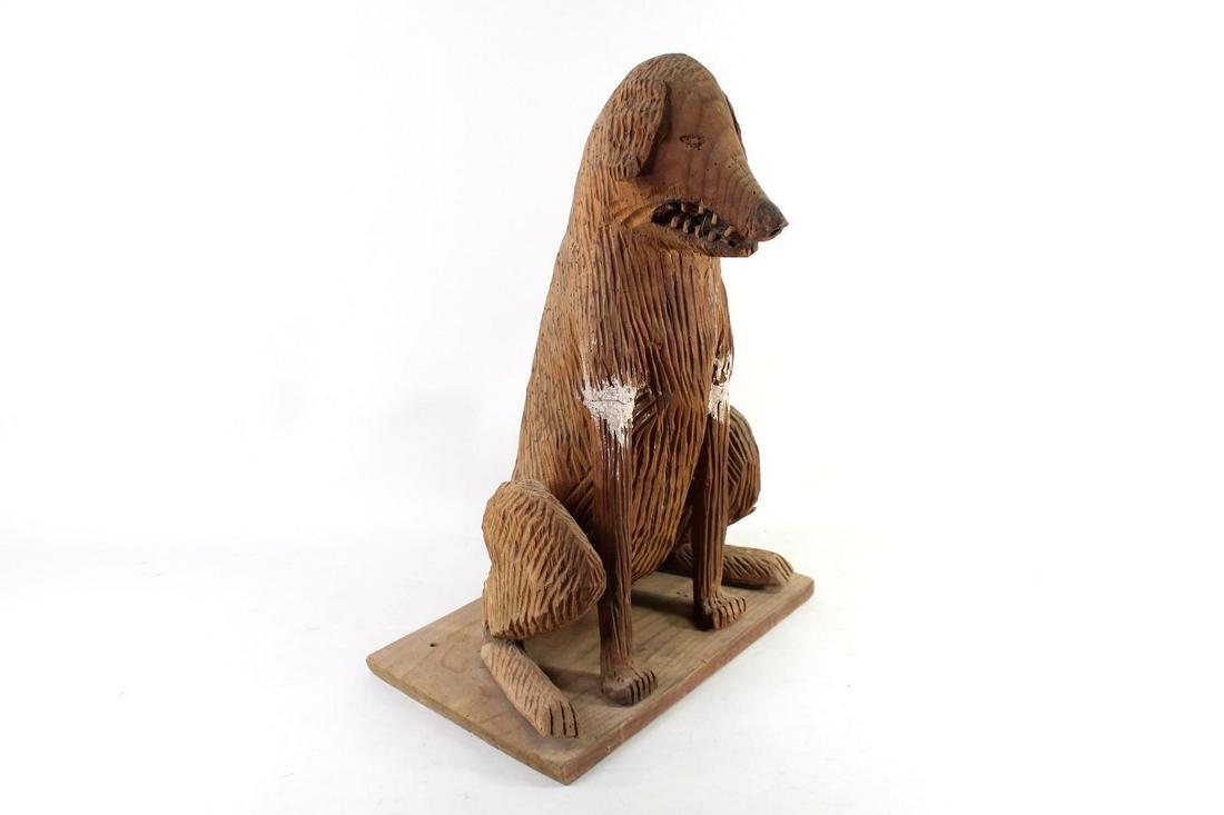 Michoacan Mexico Folk Art Carved Mean Dog Sculpture: Michoacan Mexico Folk Art Carved Mean Dog Sculpture. Incredible dog is carved of wood and is in a sitting position, with a snarling face complete with wooden teeth. So full of character! Acquired in M