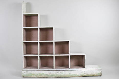 Paul Frankl Style Skyscraper Stepped Shelf: Paul Frankl Style Skyscraper Stepped Shelf. A wooden stepped shelving case on a raised base. White-painted exterior with an under layer of green coming through. It has great patinathroughout. A wonder