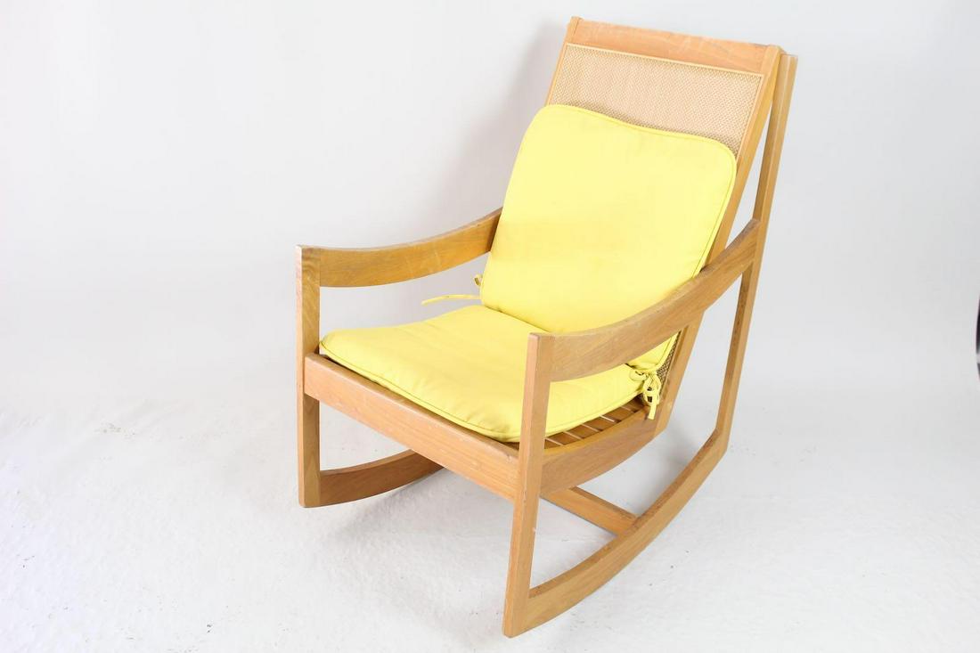 Mid Century Modern Caned Back Lounge Rocking Chair: Mid Century Modern Caned Back Lounge Rocking Chair. Cheery chair has a frame of wood, with a caned back and yellow cushions o seat and back. Looks similar to a chair by PaoliChair Company, but there a