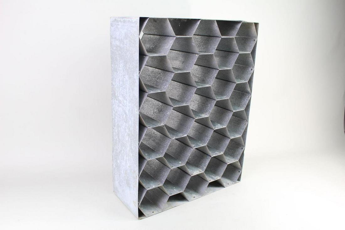 Industrial Galvanized Metal Honeycomb 28 Slot Wine Rack: Industrial Galvanized Metal Honeycomb 28 Slot Wine Rack. Made of galvanized metal, rack with hexagonal shaped openings can hold up to 28 bottles of wine. Honeycomb is framed with galvanized sheet meta