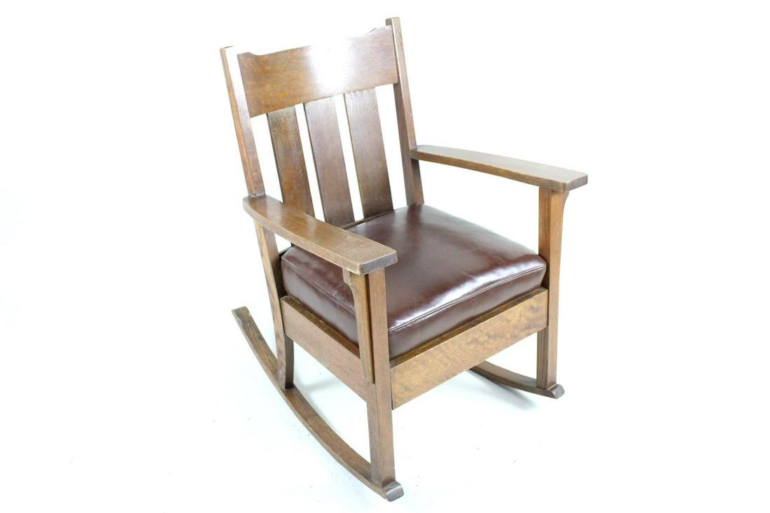 Brown Leather & Oak Arts & Crafts Mission Rocking Chair: Brown Leather Seat Arts & Crafts Oak Wood Rocking Chair. Sturdy chair in the Arts & Crafts/Mission/Stickley style, with removable dark brown leather seat cushion that goes nicely with medium-dark stai