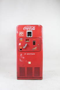 Coca-Cola 10-Cent Vendorlator VMC 33 Vending Machine: Coca-Cola 10-Cent Vendorlator VMC 33 Vending Machine. A 1950s coin operated vending machine, model VMC 33. Front hatch can be opened to empty coins and bottle caps. The larger door to fill up bottles