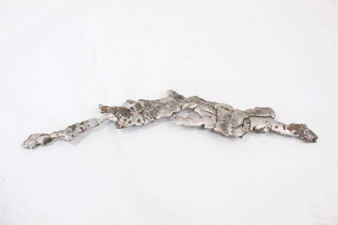 Brutalist Metal Slag Found Art Sculpture, Chemiakin, 26: Abstract Metal Splatter Found Art, Chemiakin 26 of 35 Mixed metals Weight: 12.5 lbs Dimensions are 1.75 in h x 33.25 in w x 5.75 in d. This metal slag piece was handpicked by artist Mihail Chemiakin (