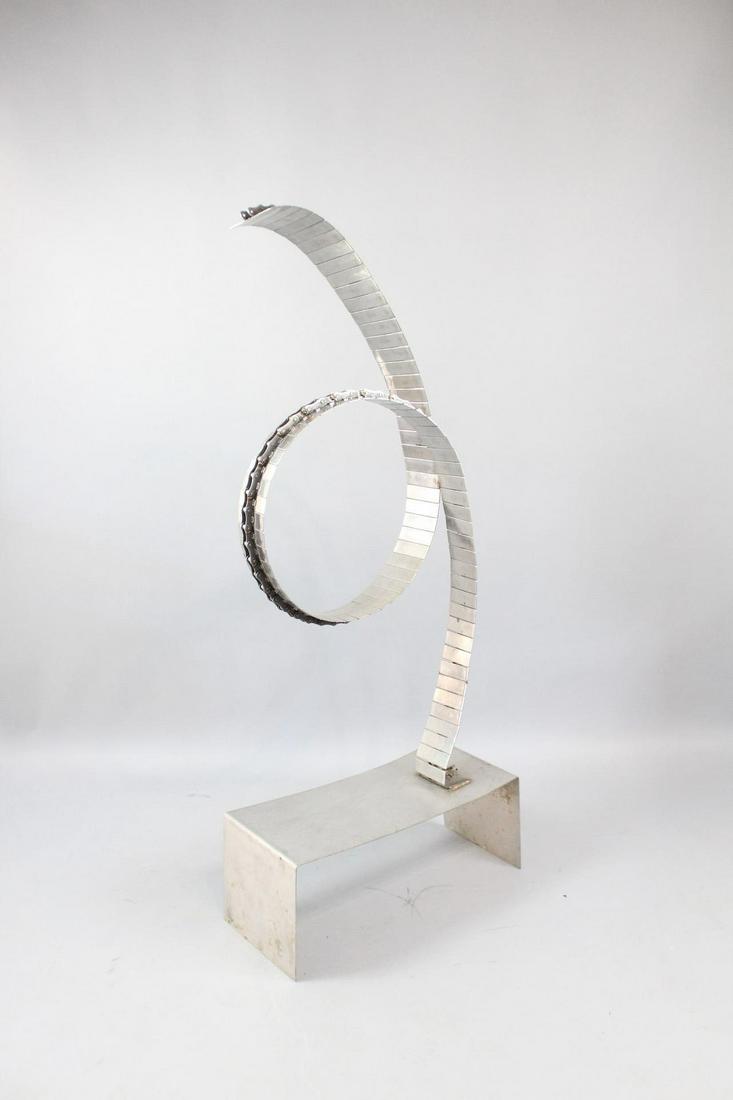 Large Modern Industrial Steel Conveyor Belt Sculpture: Large Modern Industrial Steel Conveyor Belt Sculpture. Unusual abstract artwork is made completely from metal. We believe that it may be made of a steel conveyor belt, transformed into art by twisting